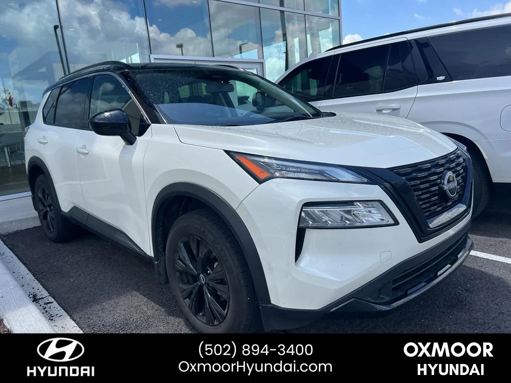 Used 2023 Pearl White Tricoat/Super Black Nissan SV image 1