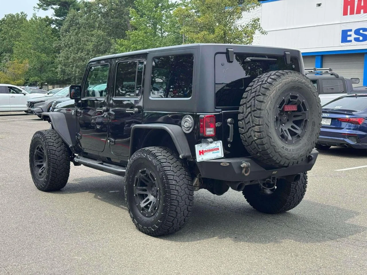 Used 2015 Black Clearcoat Jeep Sport image 6