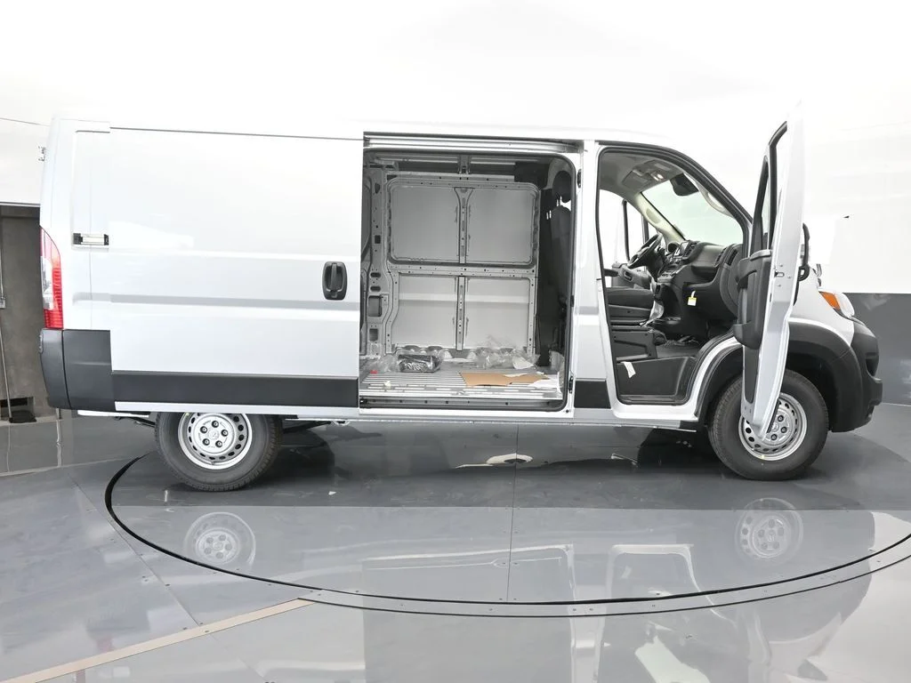 Used 2025 Bright Silver Clearcoat Metallic Ram Low Roof image 64