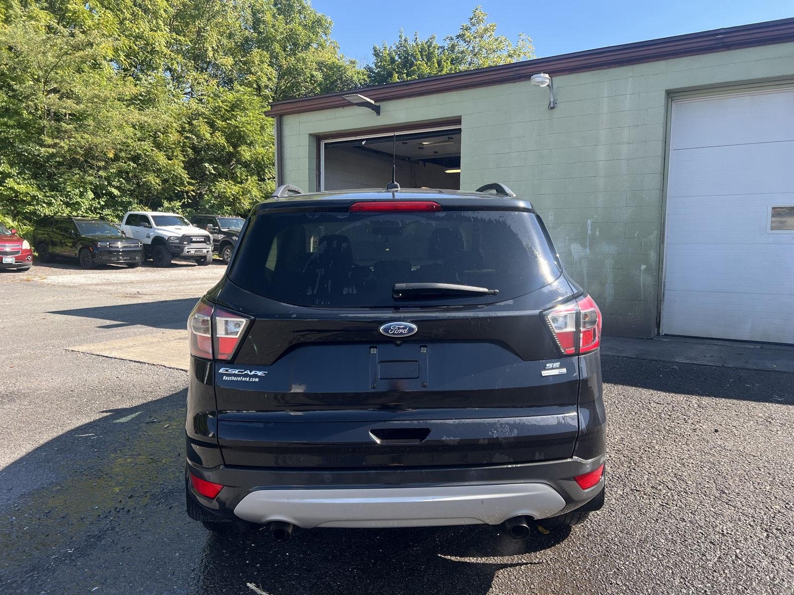 Used 2017 Shadow Black Ford SE image 4