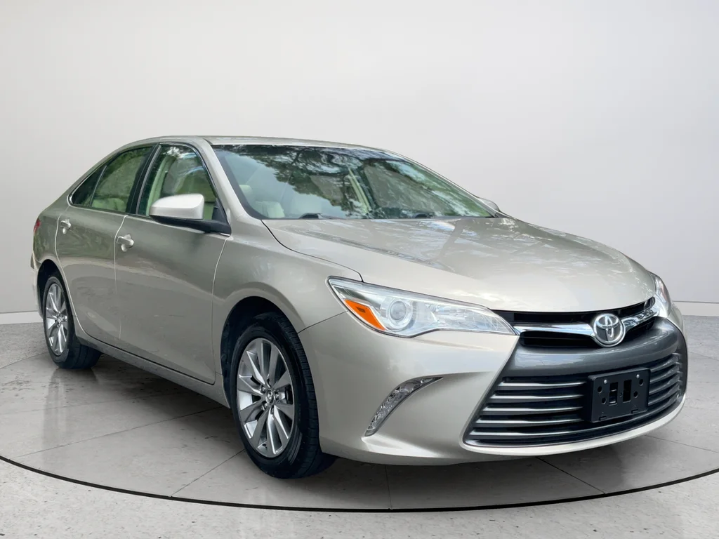 Used 2016 Gold Toyota XLE image 1