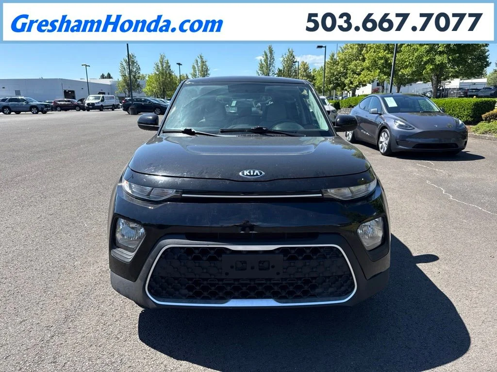 Used 2021 Cherry Black Kia LX image 1