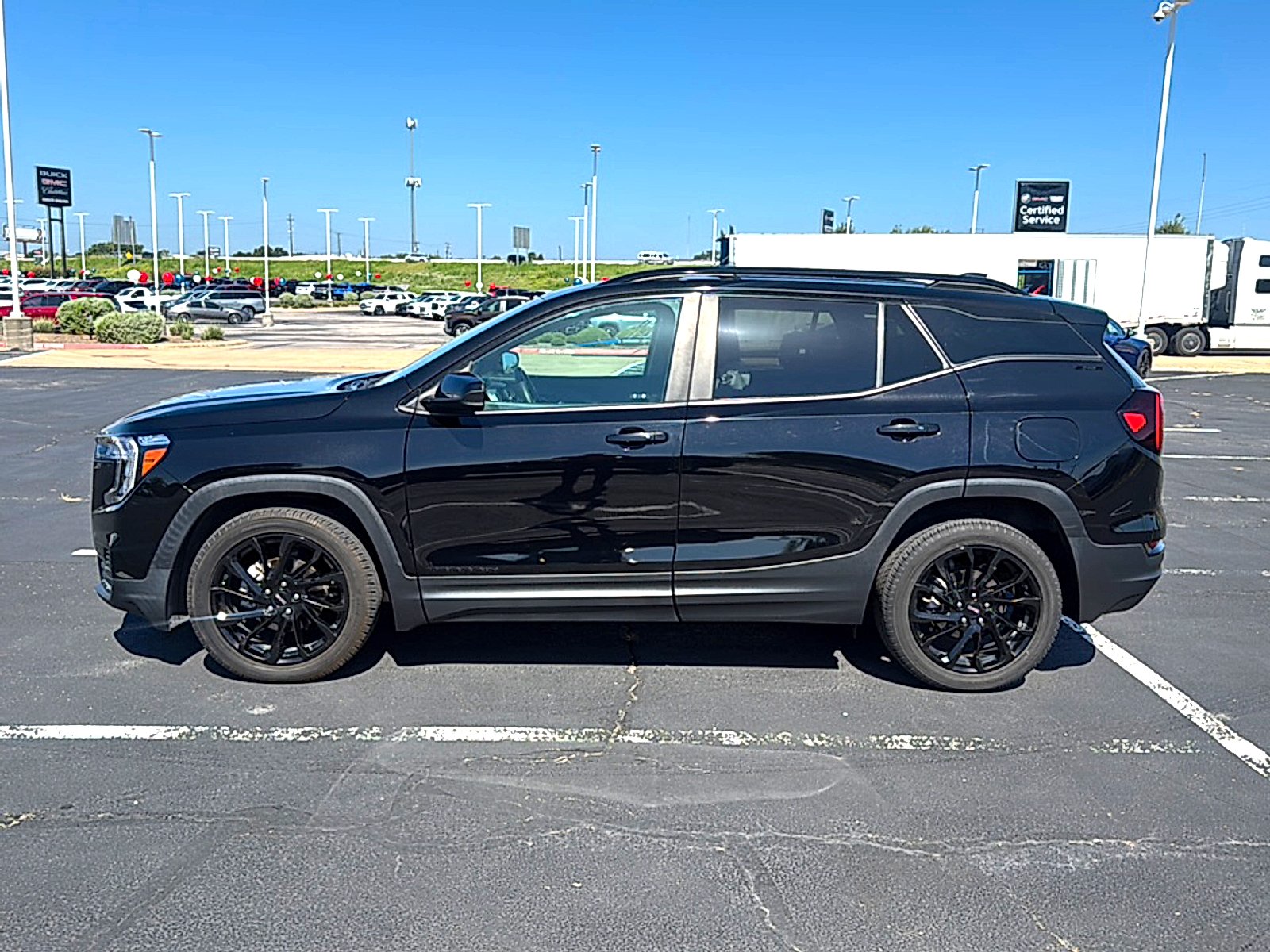 Used 2024 Ebony Twilight Metallic GMC SLE image 5