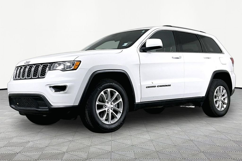 Used 2021 White Jeep Laredo E image 1
