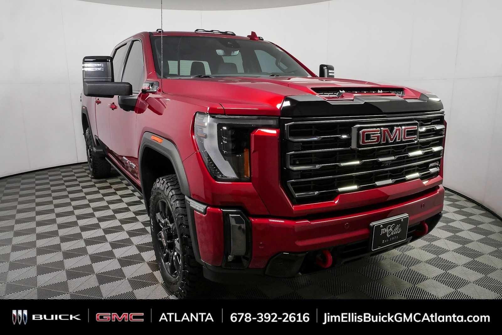 Used 2024 Volcanic Red Tintcoat GMC AT4 image 1