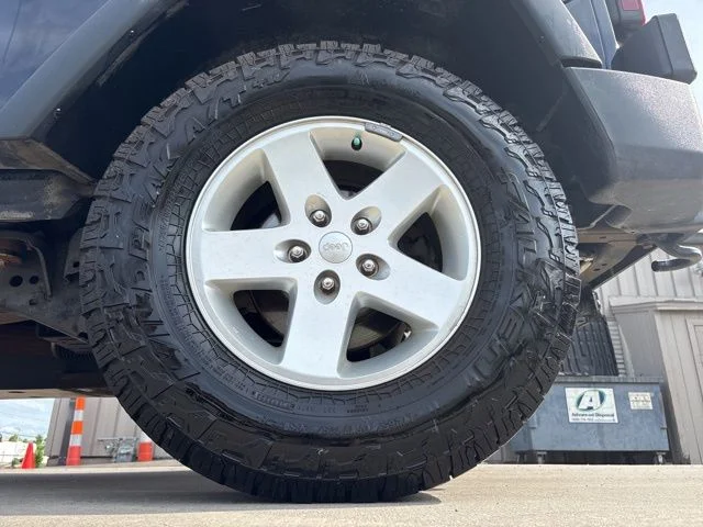Used 2013 Blue Jeep Unlimited Sport image 9