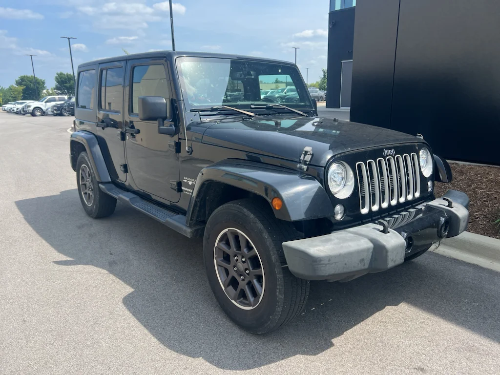 Used 2018 Black Clearcoat Jeep Sahara image 1
