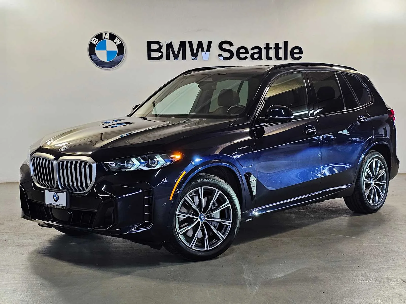 Used 2024 Carbon Black Metallic BMW xDrive50e image 1