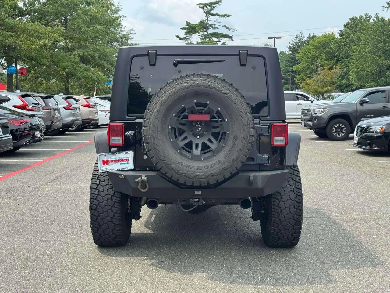 Used 2015 Black Clearcoat Jeep Sport image 7