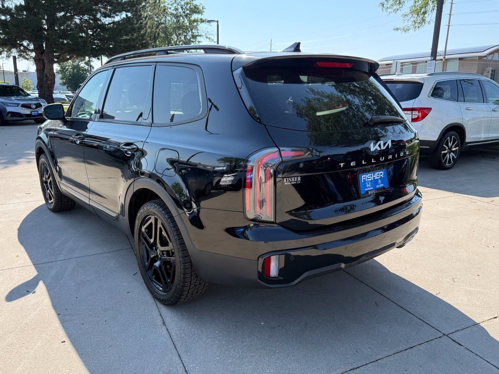 Used 2024 Ebony Black Kia EX X-Line image 6
