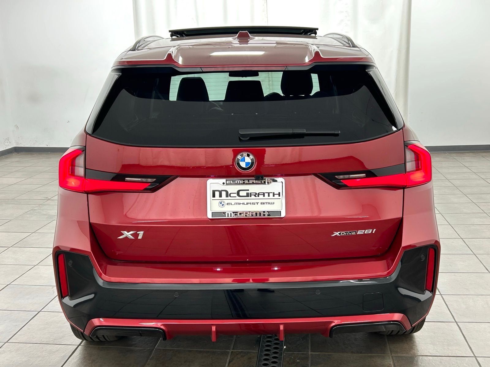 New 2026 Vegas Red Metallic BMW xDrive28i image 4