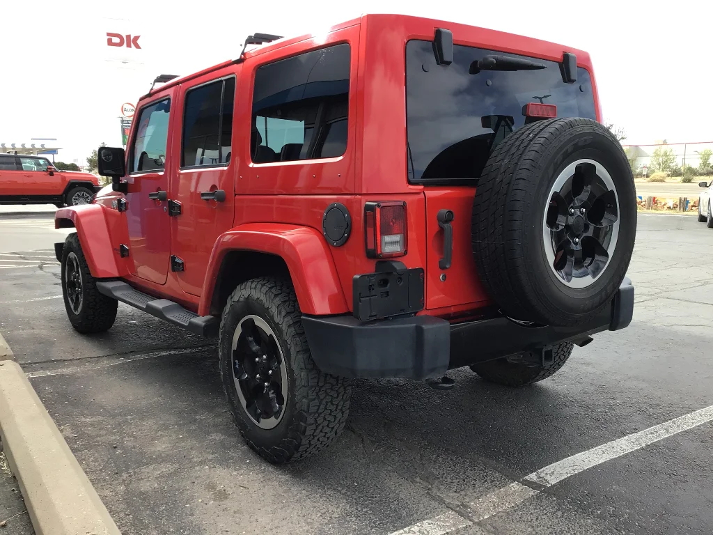 Used 2014 Red Jeep Unlimited Sahara image 4
