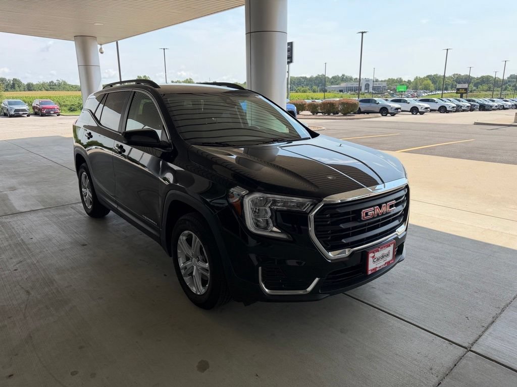 Used 2024 Ebony Twilight Metallic GMC SLE image 1
