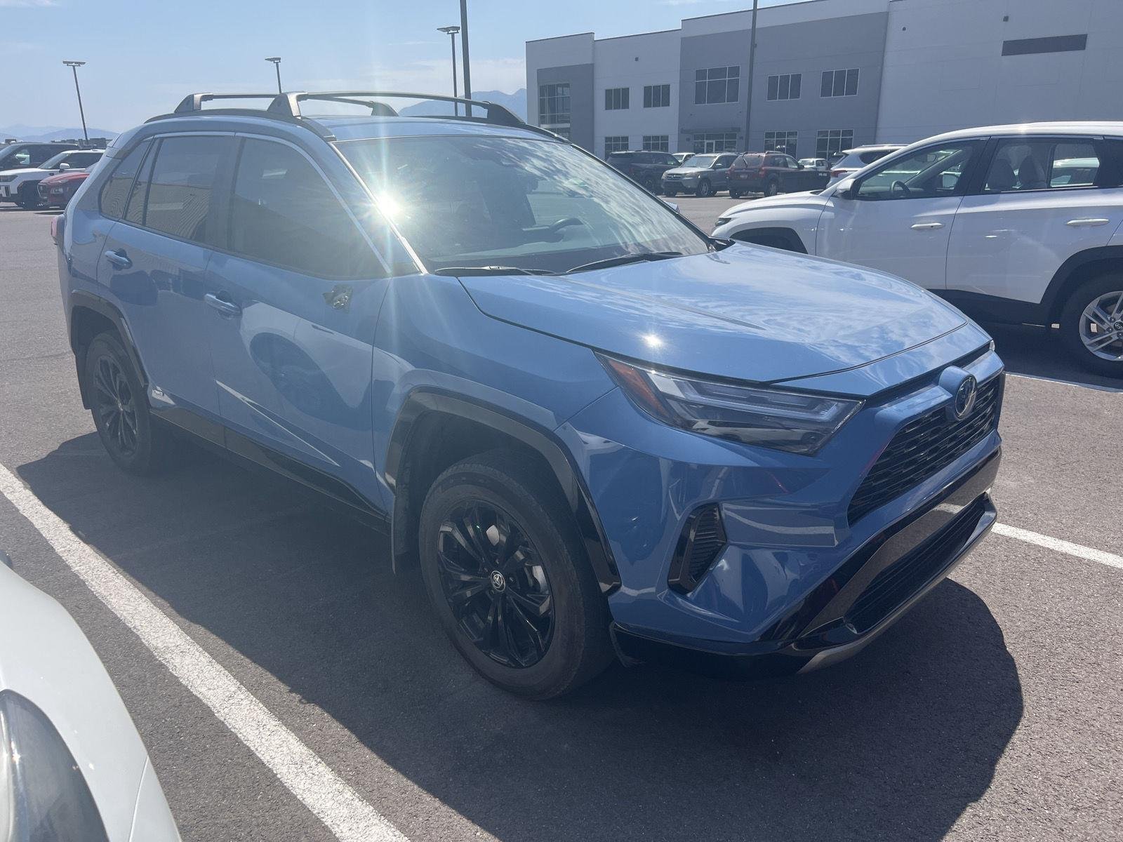 Used 2024 Cavalry Blue Toyota Hybrid SE image 2