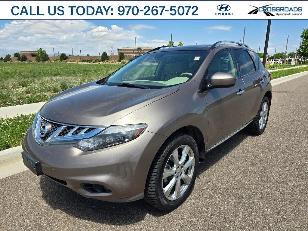 Used 2014 Tinted Bronze Metallic Nissan LE image 1