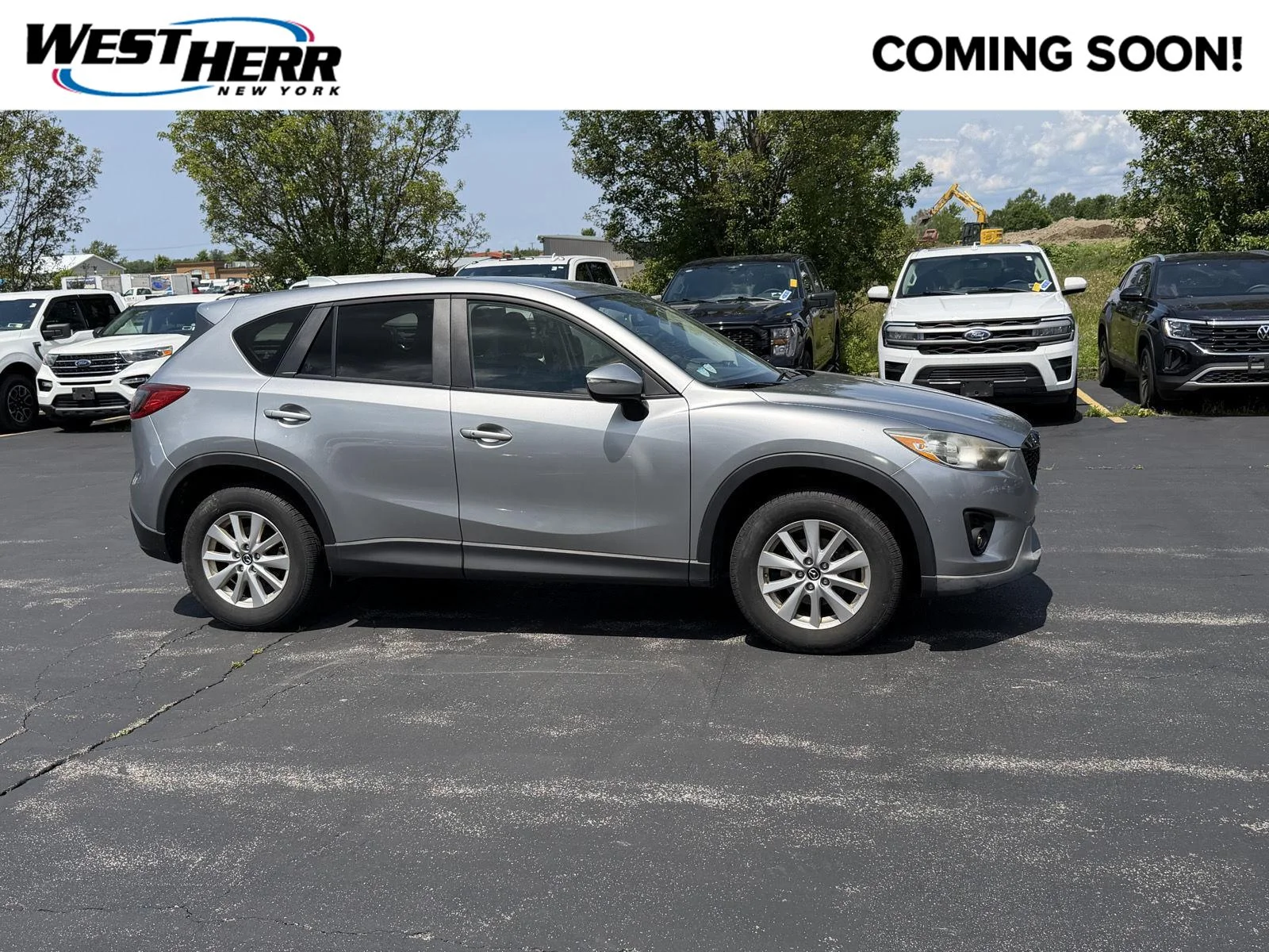 Used 2015 Liquid Silver Mazda Touring image 1