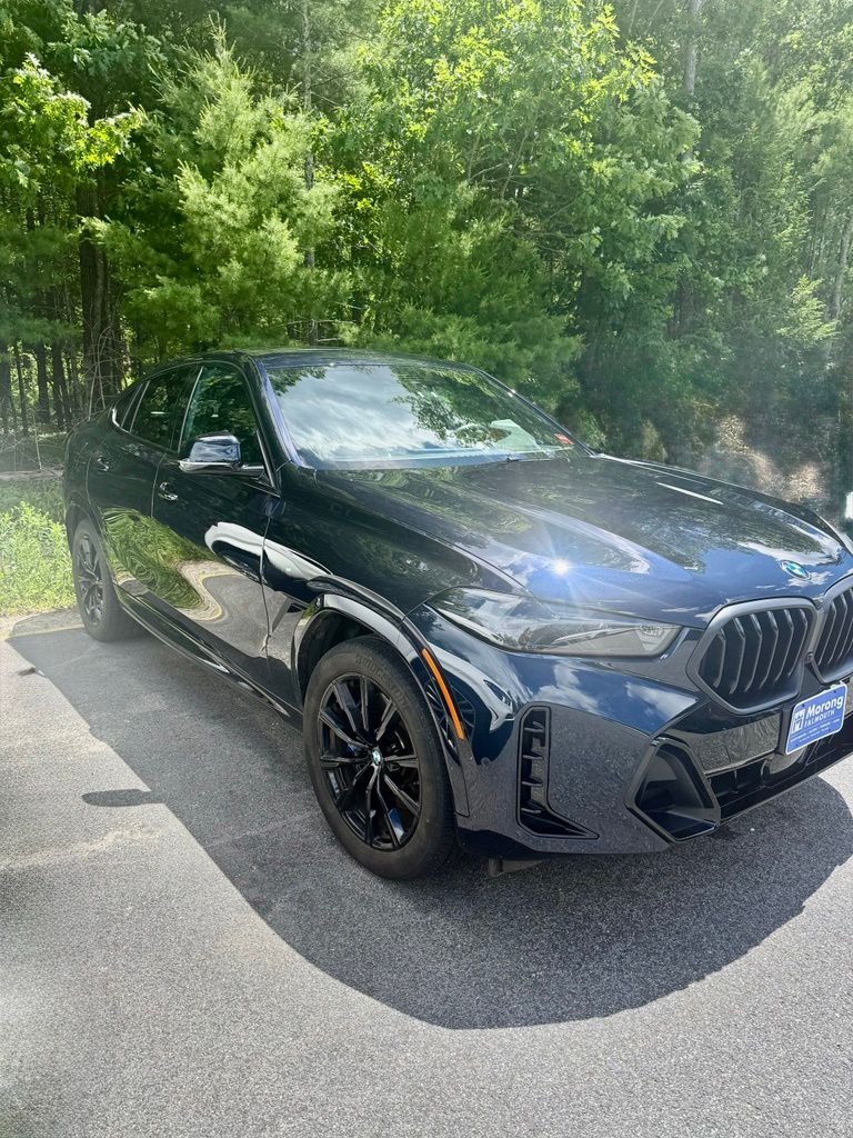 Used 2024 Black BMW xDrive40i image 1