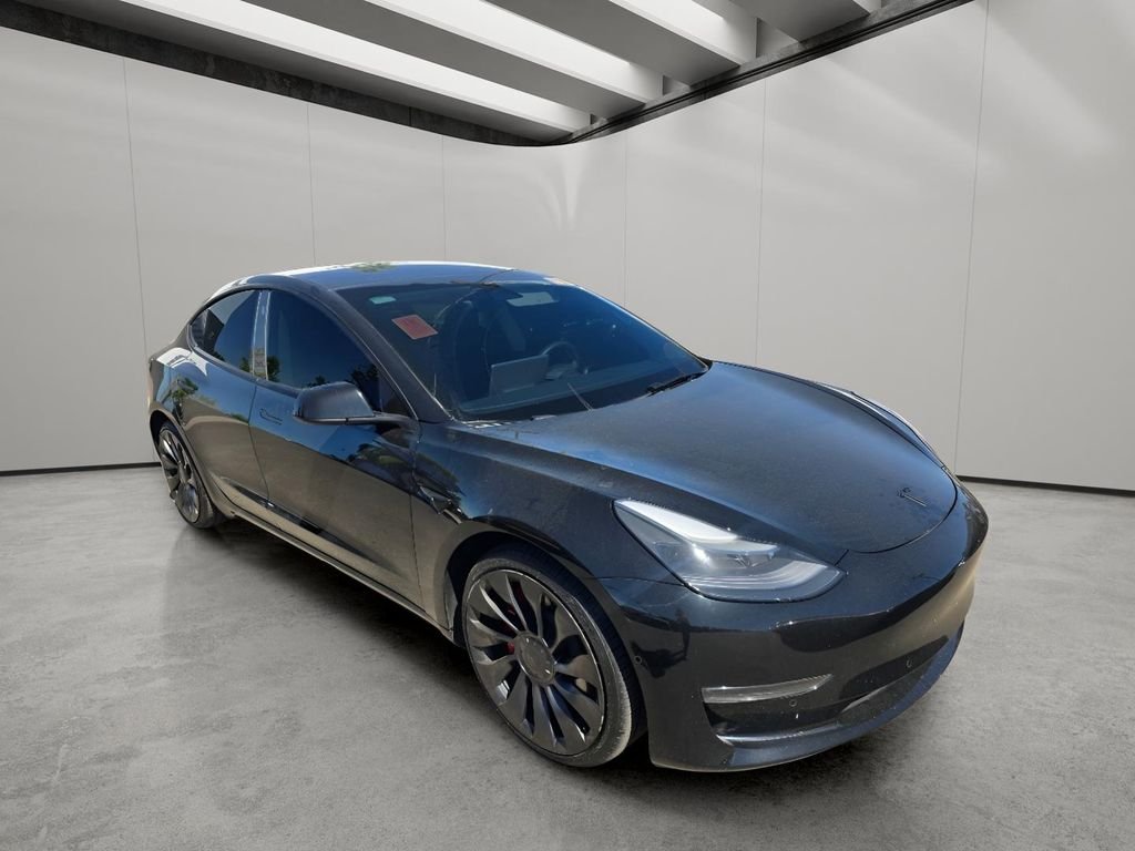 Used 2022 Solid Black Tesla Performance image 13