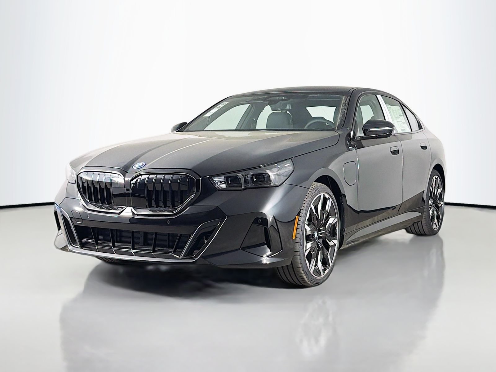 New 2027 Black Sapphire Metallic BMW 550e xDrive image 3