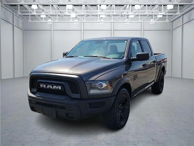 Used 2024 Granite Crystal Metallic Clearcoat RAM SLT 4x2 Crew Cab 5.6 ft. box 140 in. WB image 1