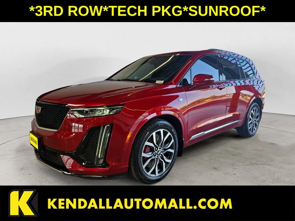Used 2024 Radiant Red Tintcoat Cadillac Sport image 1
