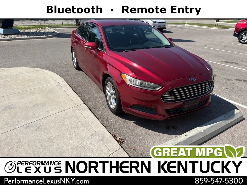Used 2013 Ruby Red Metallic Ford SE image 1