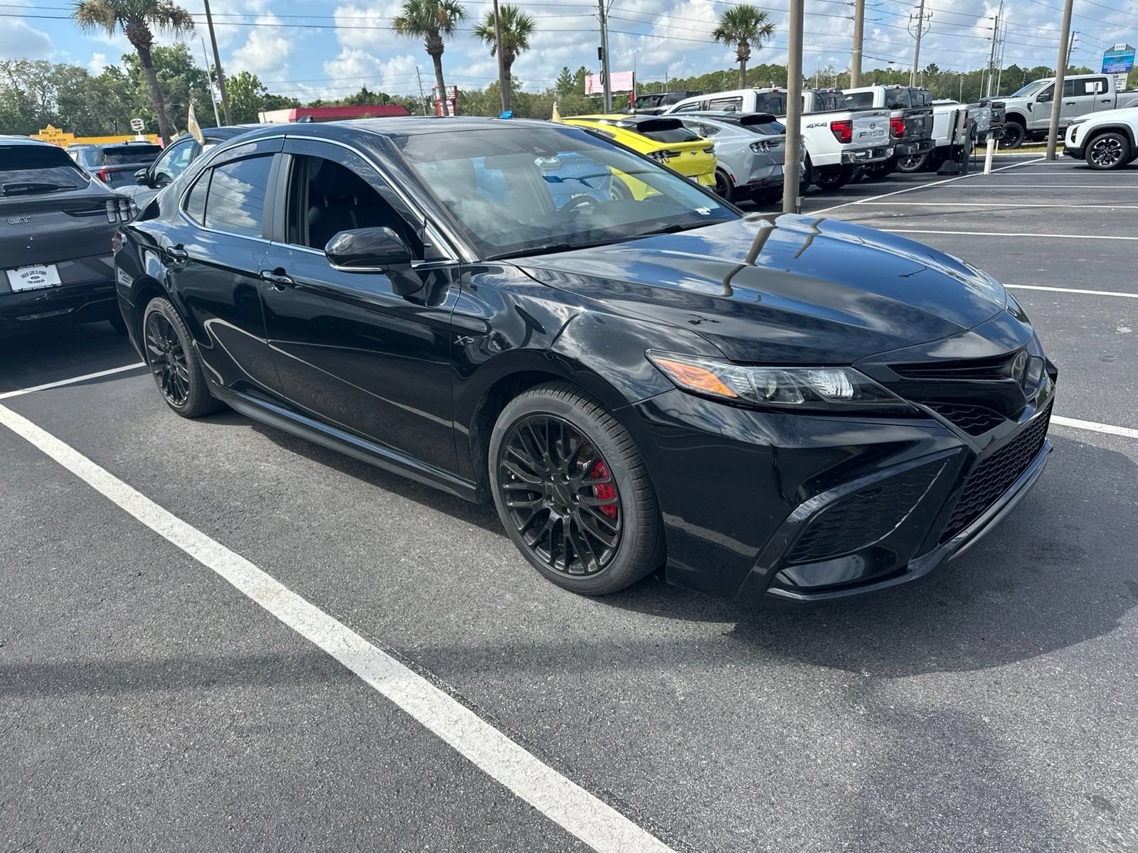 Used 2023 Midnight Black Metallic Toyota SE image 3