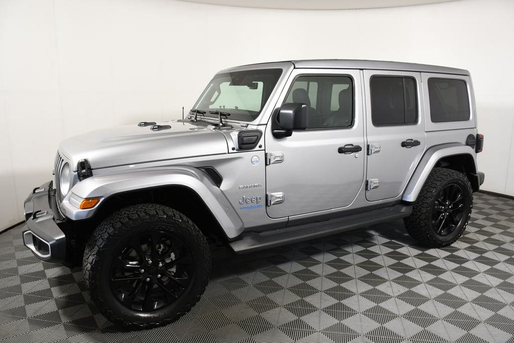 Used 2021 Jeep Wrangler Unlimited Sahara 4XE with VIN 1C4JJXP69MW642093 for sale in Richfield, Minnesota