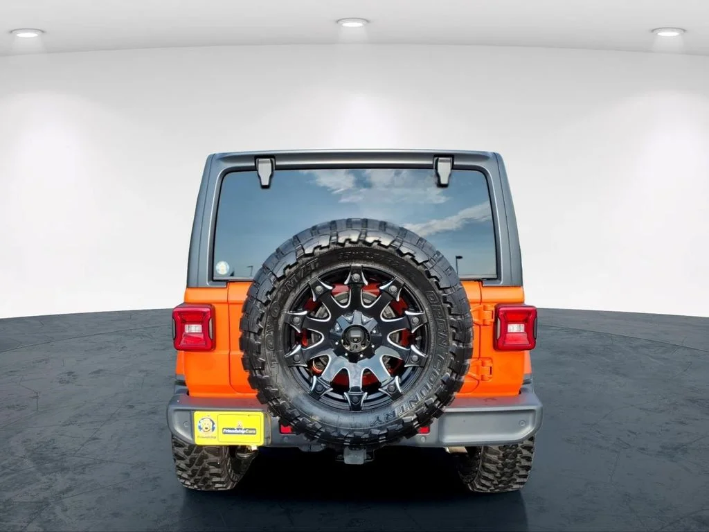 Used 2018 Orange Jeep Unlimited Sahara image 7