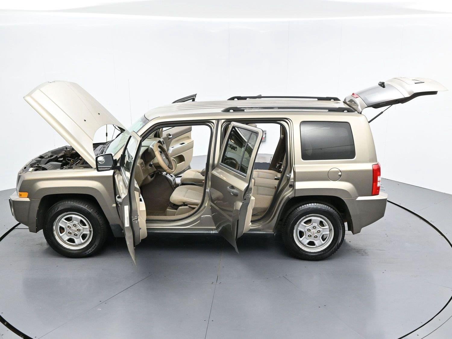 Used 2008 Light Khaki Metallic Jeep Sport image 35