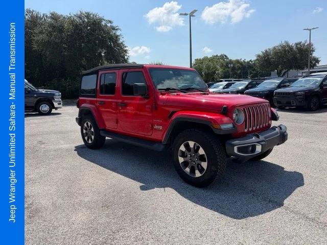 Used 2020 Red Jeep Unlimited Sahara image 1