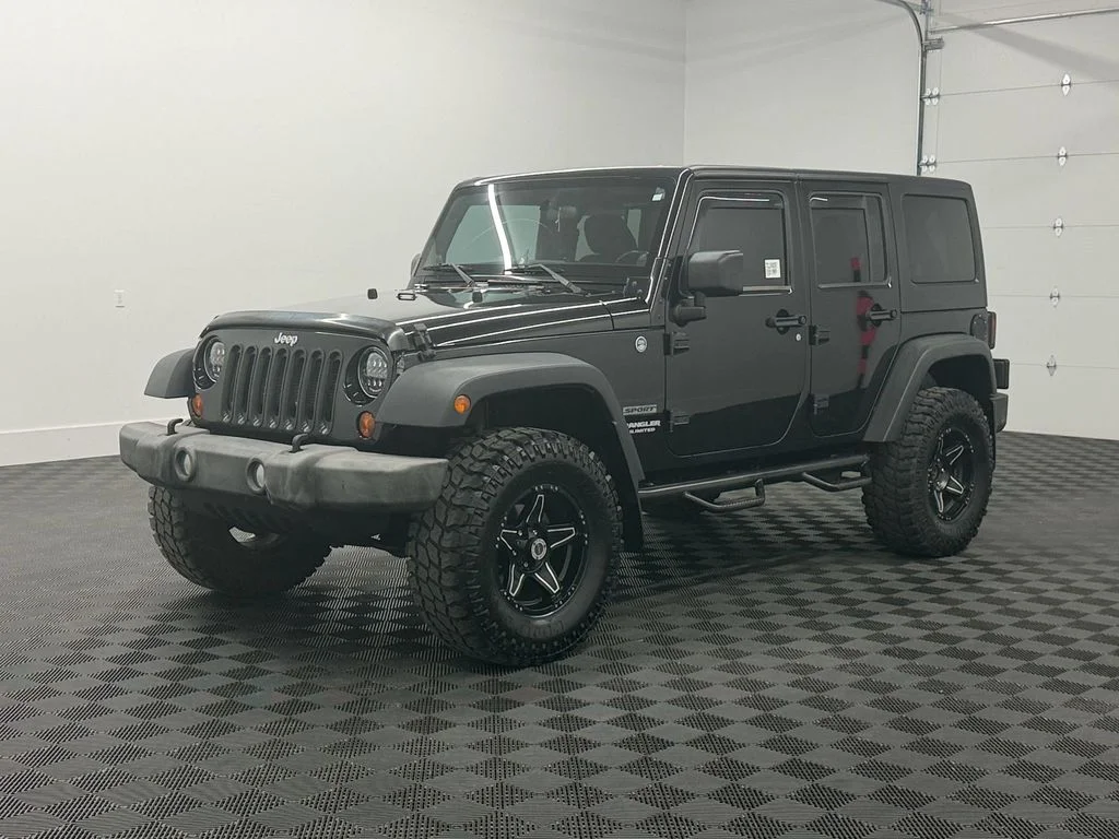 Used 2012 Black Jeep Sport image 1