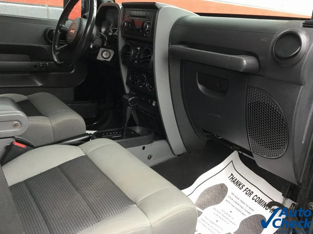 Used 2010 Black Jeep Unlimited Sport image 17