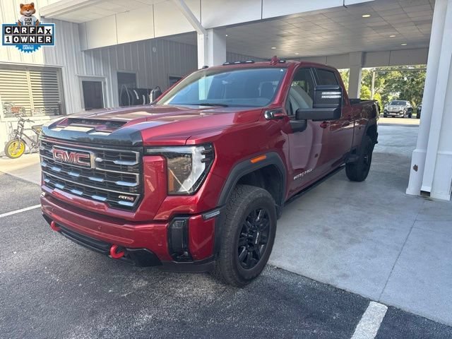 Used 2024 Volcanic Red Tintcoat GMC AT4 image 1