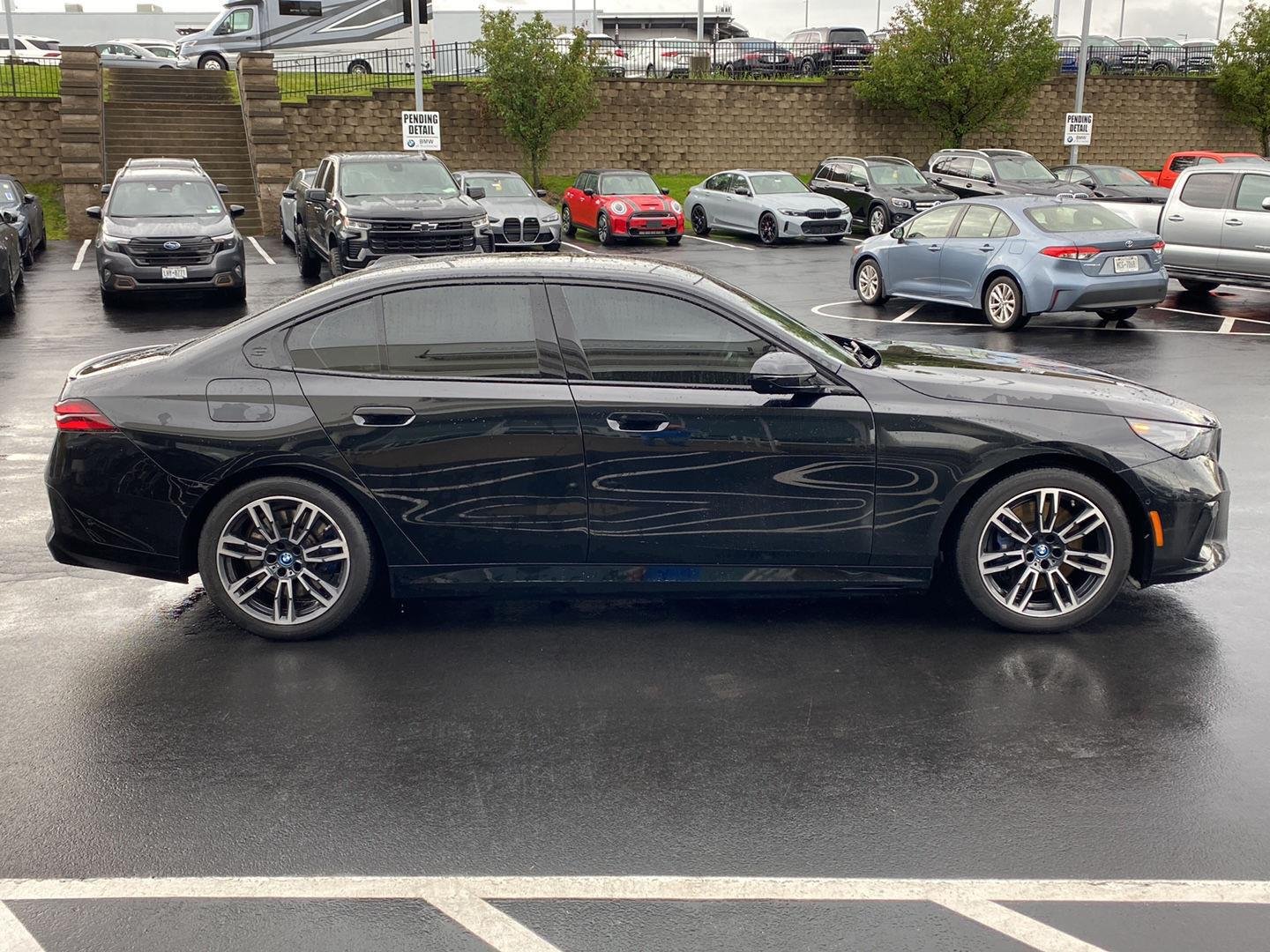 Used 2025 Black Sapphire Metallic BMW 550e xDrive image 2
