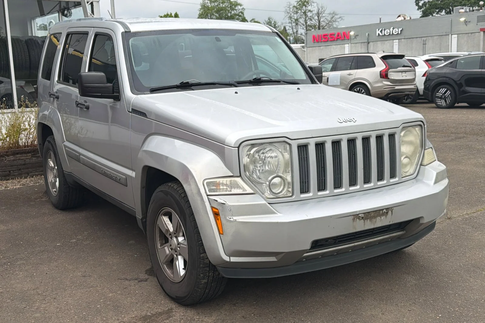Used 2011 Bright Silver Metallic Jeep Sport image 2