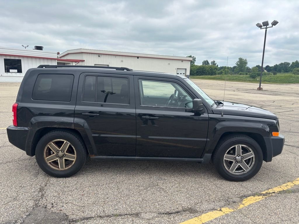 Used 2010 Black Jeep Sport image 6
