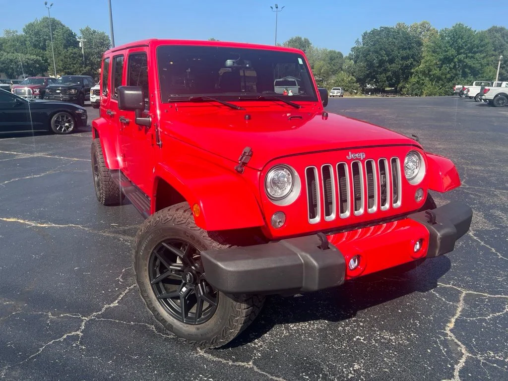 Used 2017 Firecracker Red Clearcoat Jeep Unlimited Sahara image 1