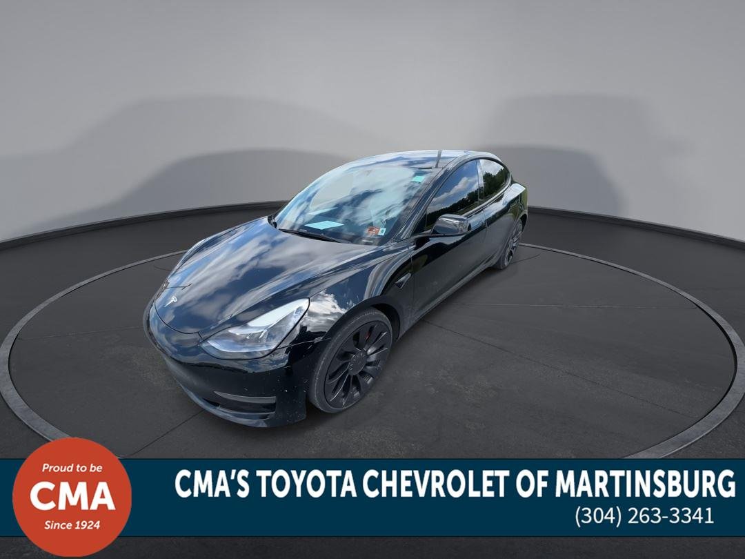 Used 2022 Solid Black Tesla Performance image 4