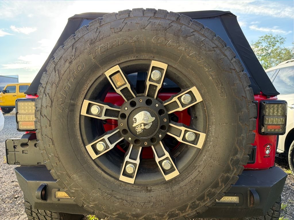 Used 2015 Firecracker Red Clear Coat Jeep Unlimited Sport image 16