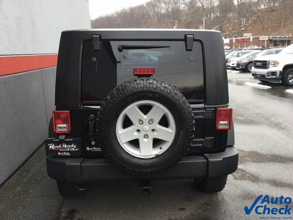 Used 2010 Black Jeep Unlimited Sport image 9