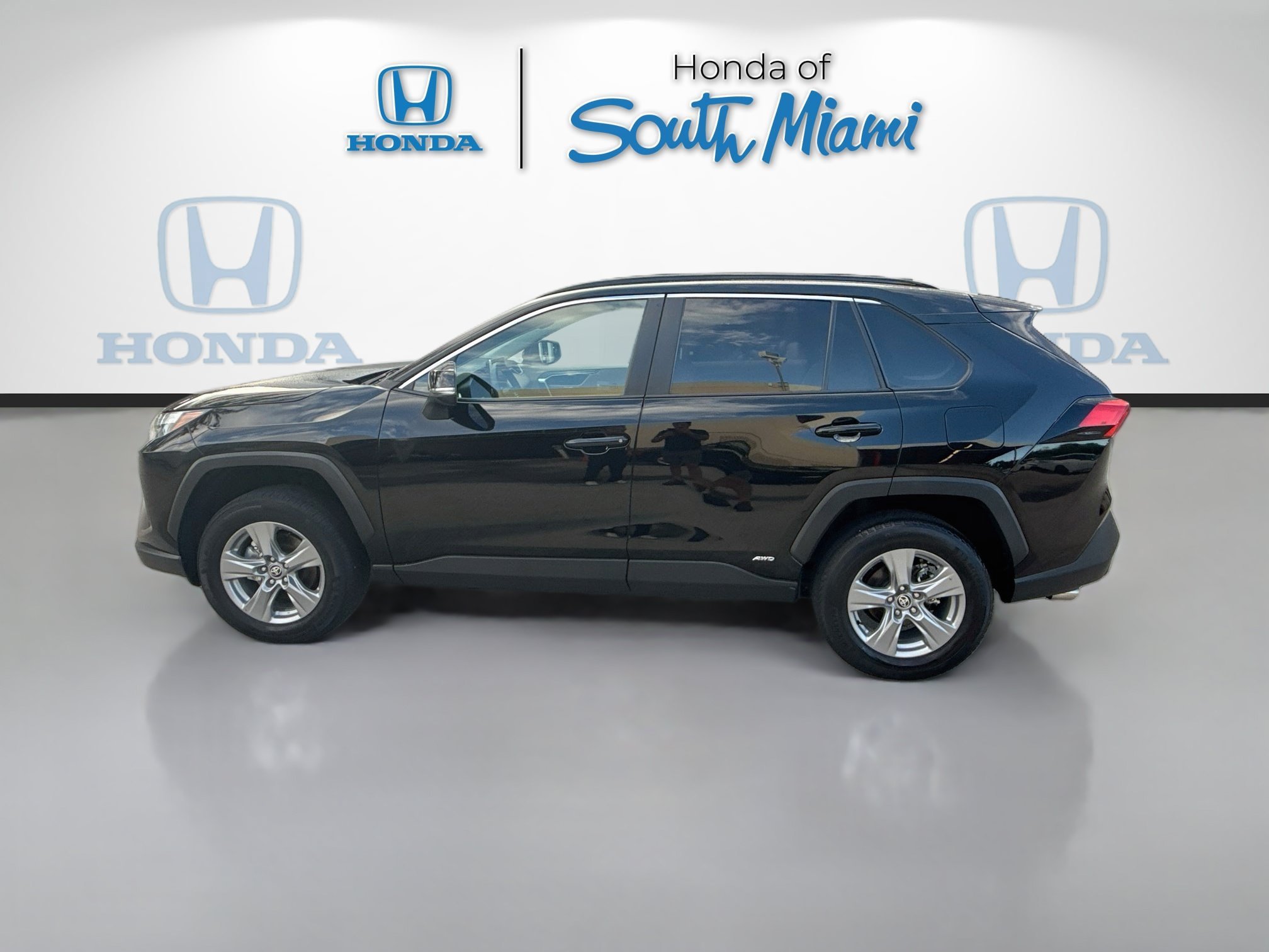 Used 2025 Midnight Black Metallic Toyota Hybrid LE image 4