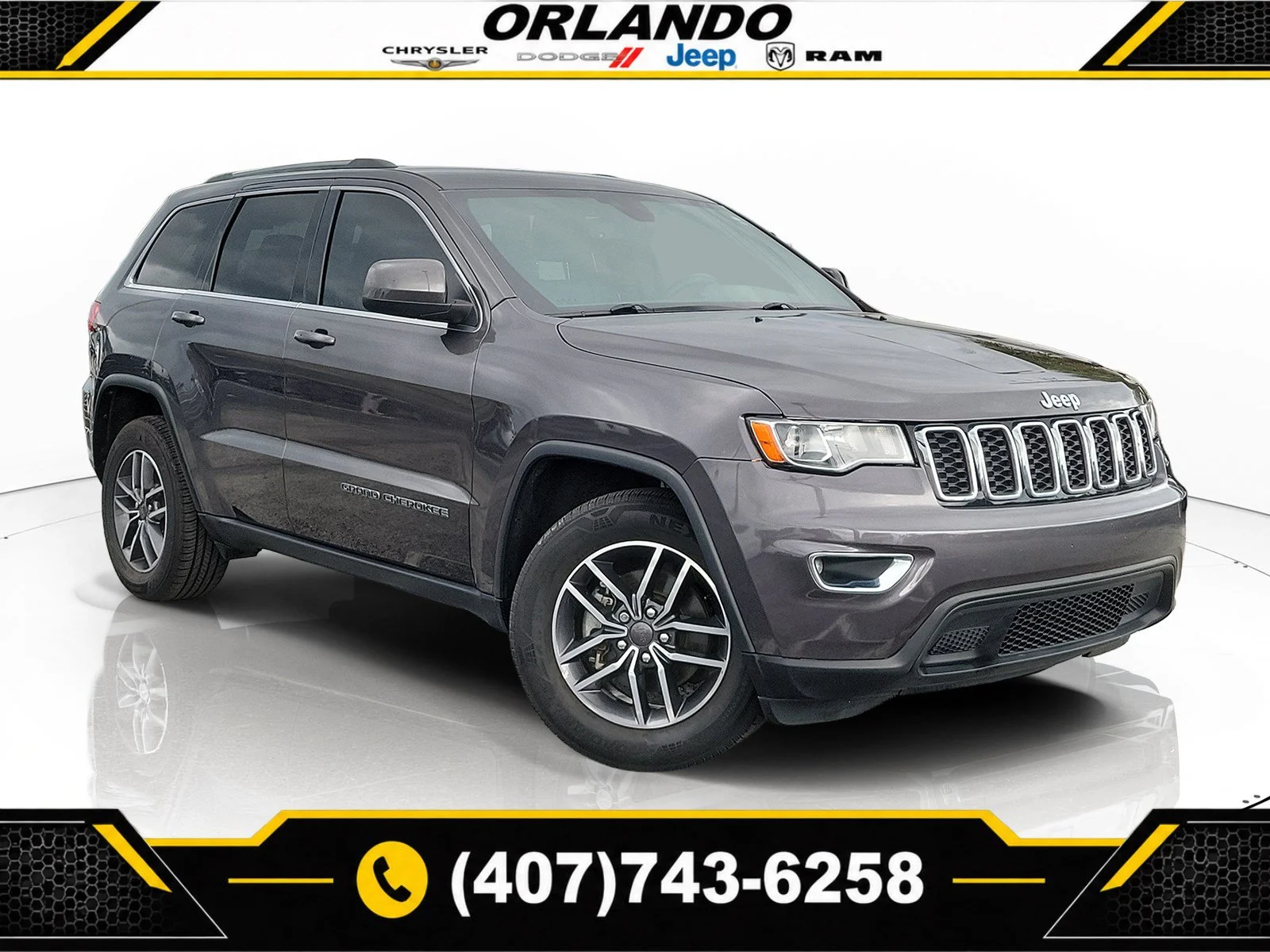 Used 2019 Granite Crystal Metallic Clearcoat Jeep Laredo E image 1