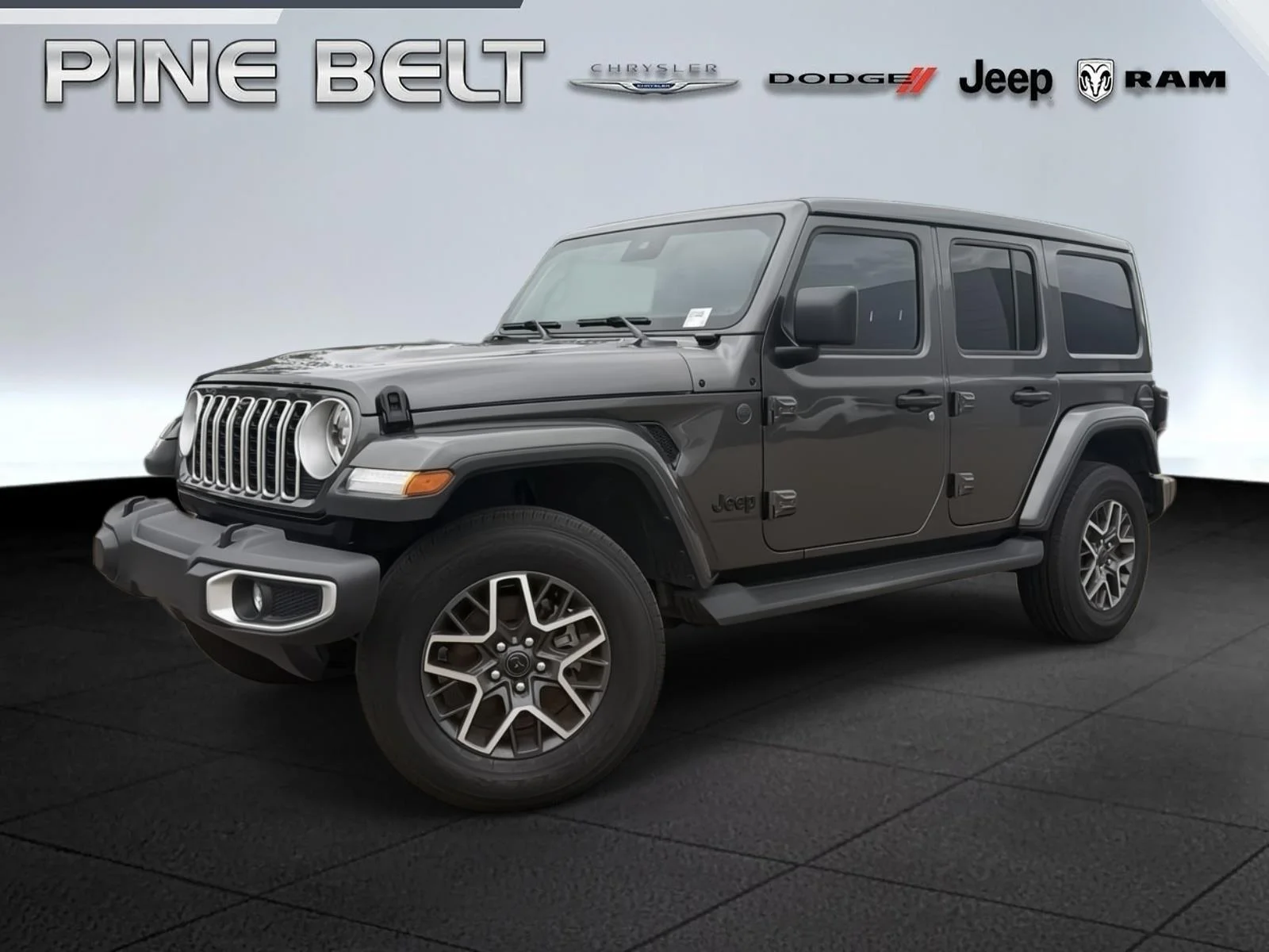 Used 2025 Granite Crystal Metallic Clearcoat Jeep Sahara image 1