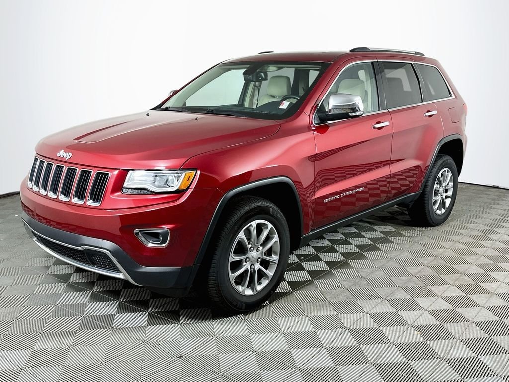 Used 2015 Deep Cherry Red Crystal Jeep Limited image 1