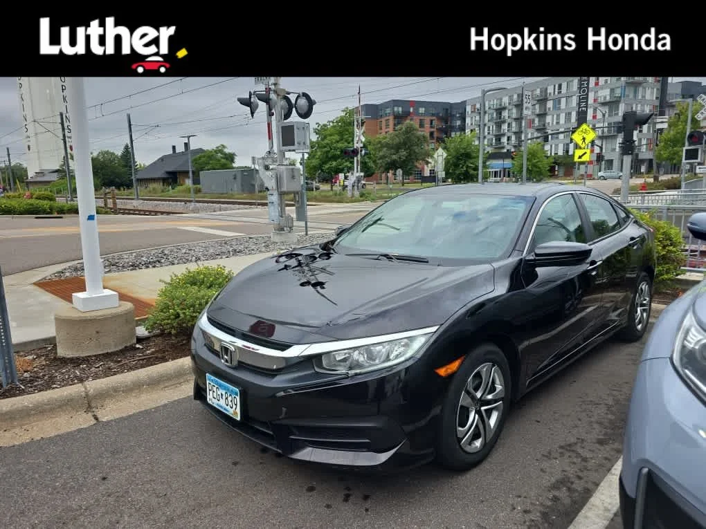 Used 2016 Burgundy Night Pearl Honda LX image 1