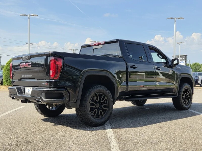 Used 2024 Onyx Black GMC 4WD CREW CAB 147" AT4 image 4