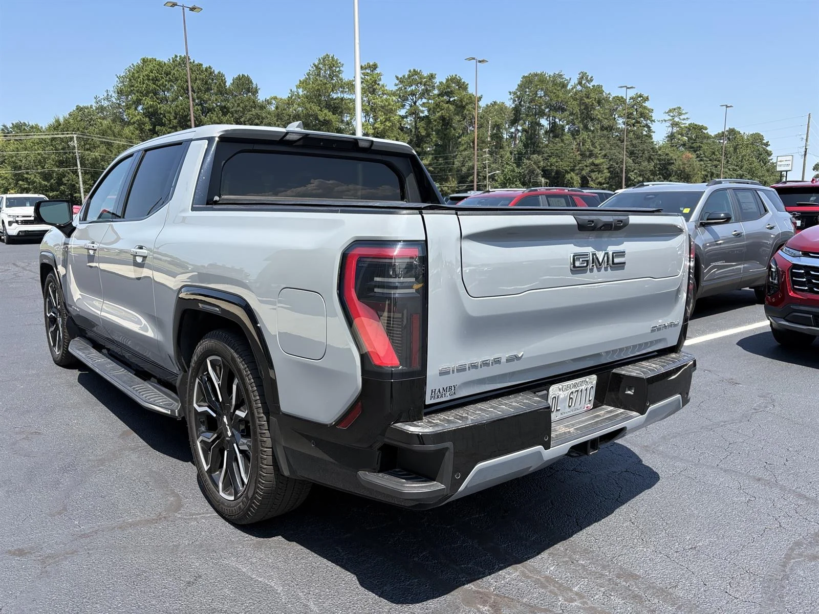 Used 2025 Thunderstorm Gray GMC Max Range Denali image 8