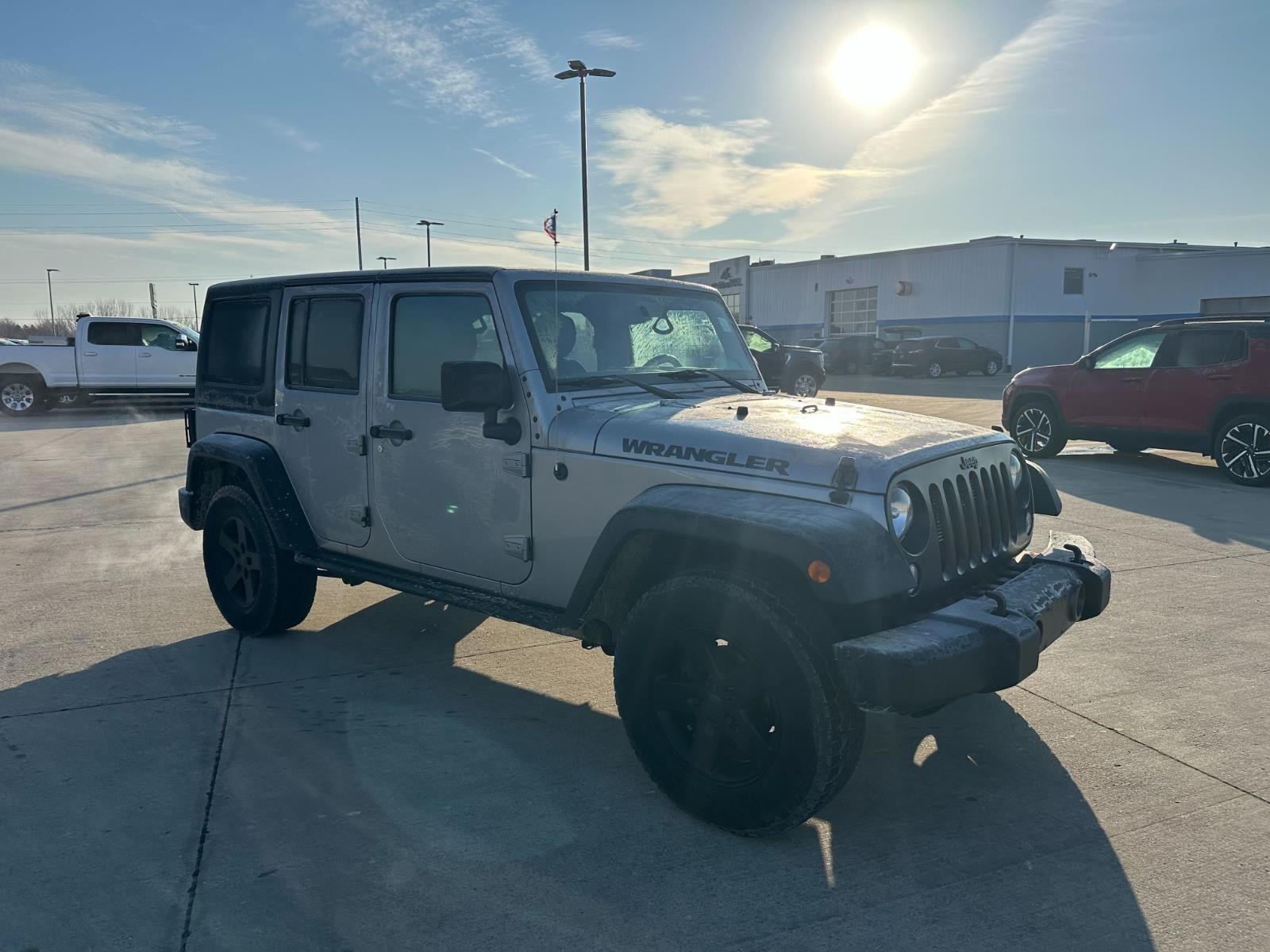 Used 2016 Jeep Wrangler Unlimited Black Bear with VIN 1C4BJWDG4GL167700 for sale in Charles City, IA