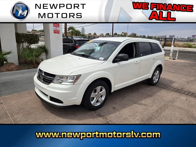 Used 2013 White Dodge American Value Pkg image 1
